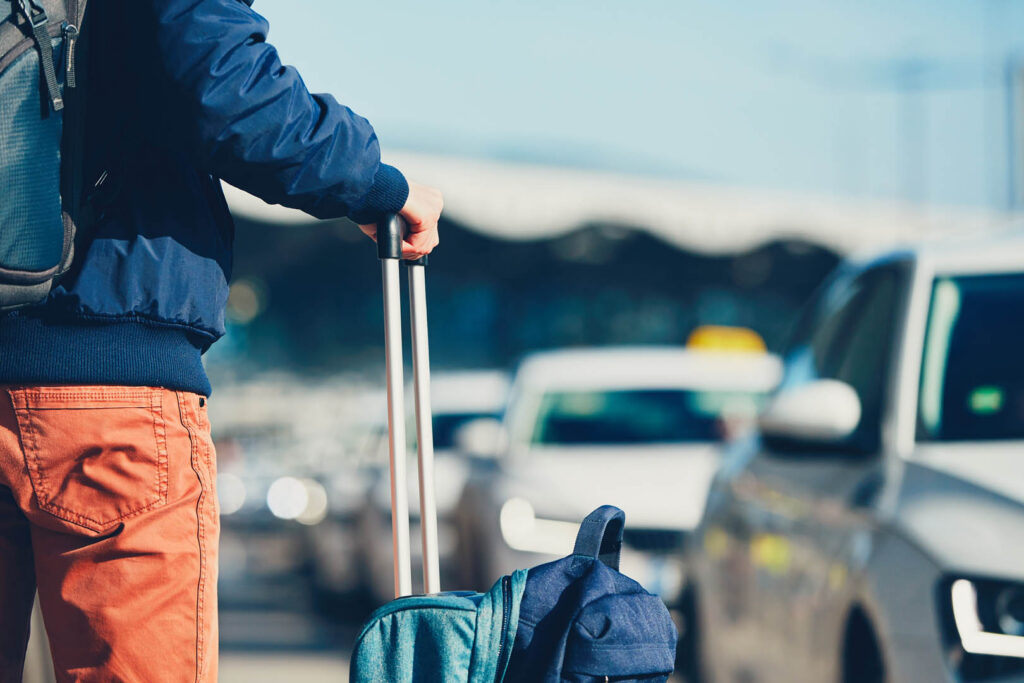 Airport taxi. Passenger is waiting for taxi car.